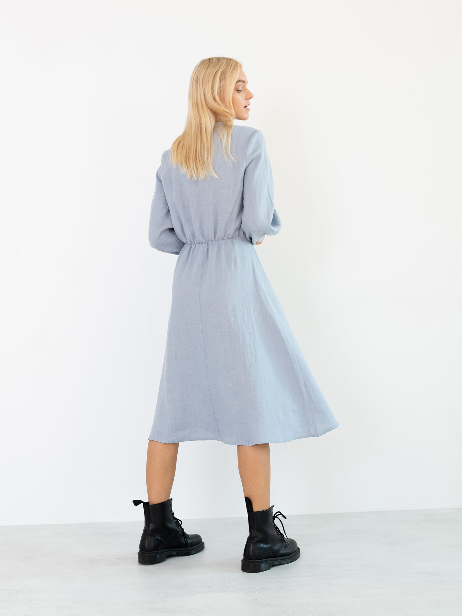 Back view of the DIA Bluestone linen dress with a softly flared midi skirt