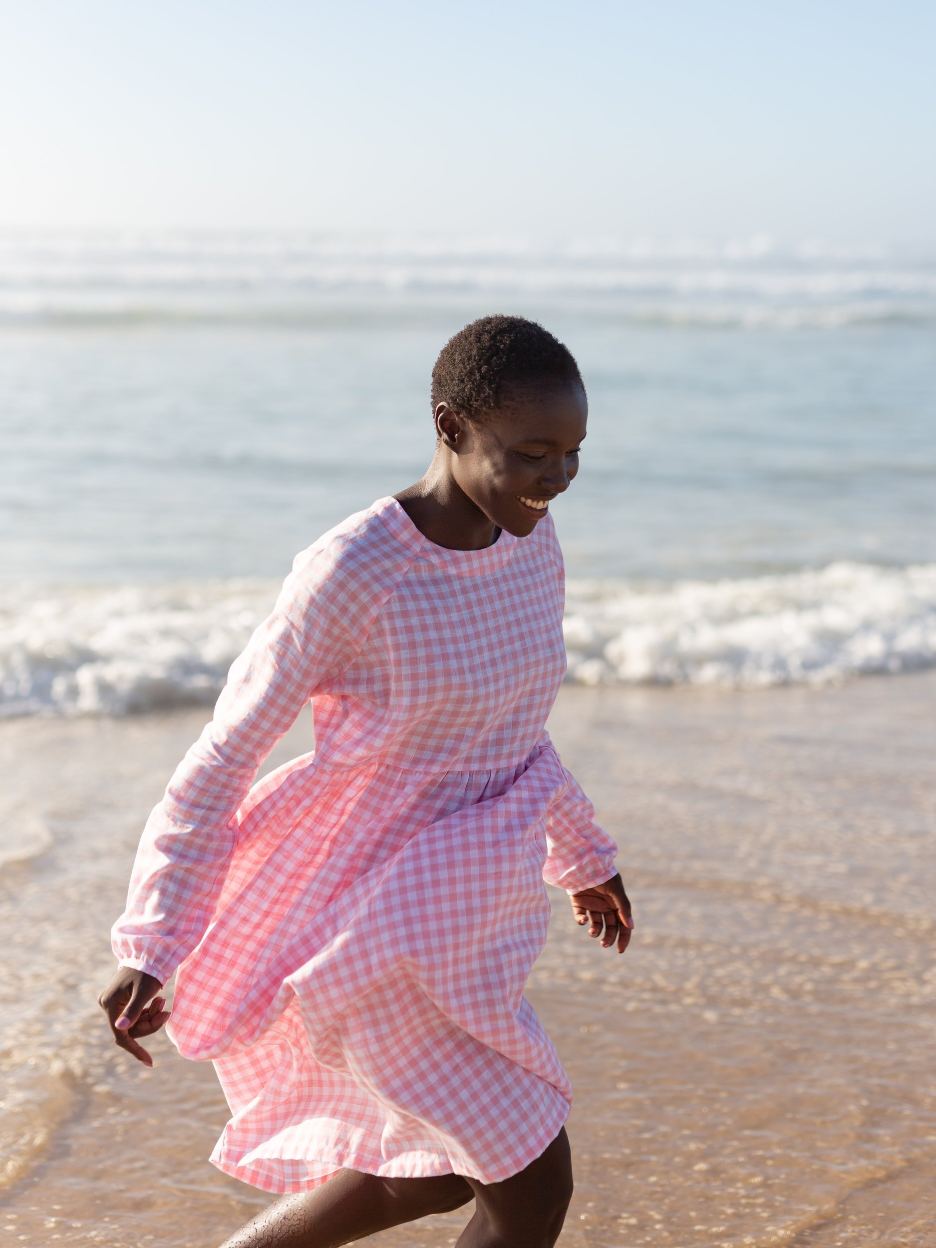Front view of the BAY long sleeve empire waist linen midi dress in Gingham Pink