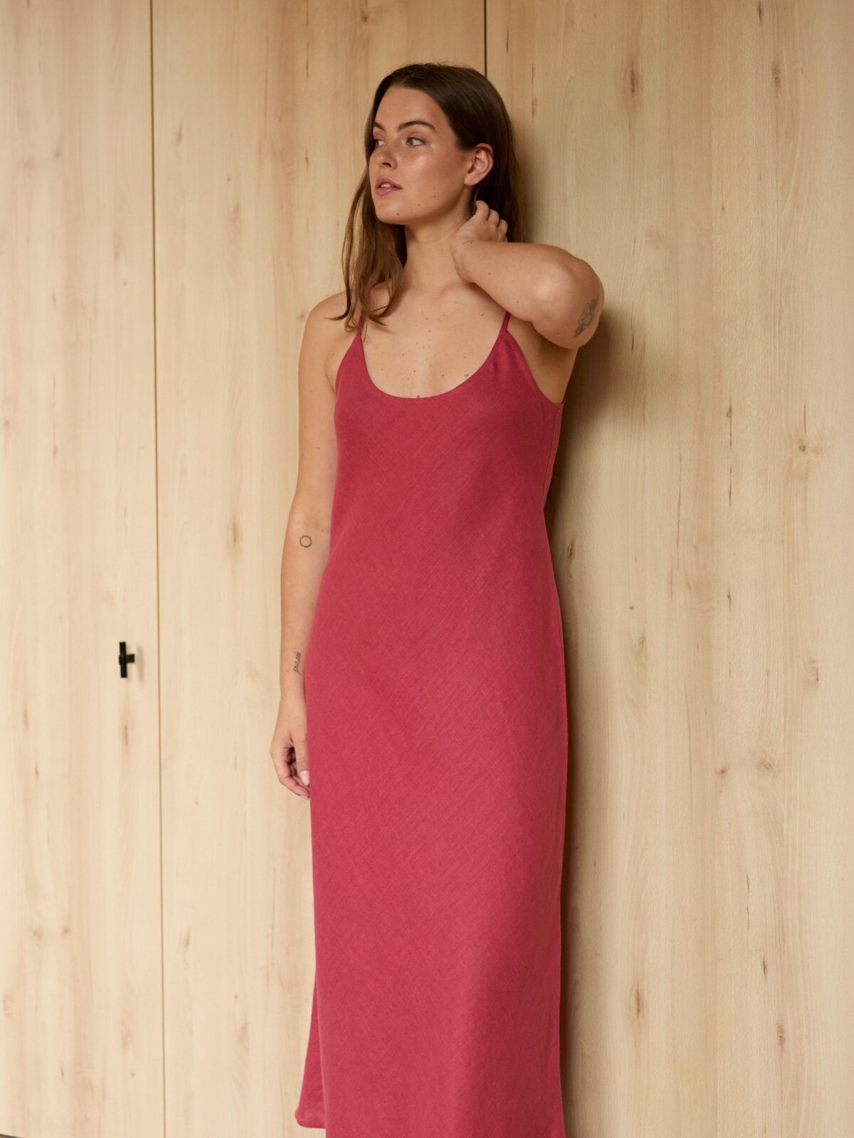 Image 1 of DIORA bias-cut linen slip dress with spaghetti straps and midi length, elegant evening wear from Love and Confuse | Raspberry Color