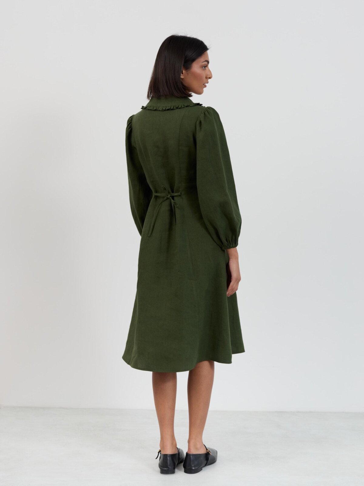 Full-length view of the Aubrey linen button down midi dress in forest green showing relaxed fit