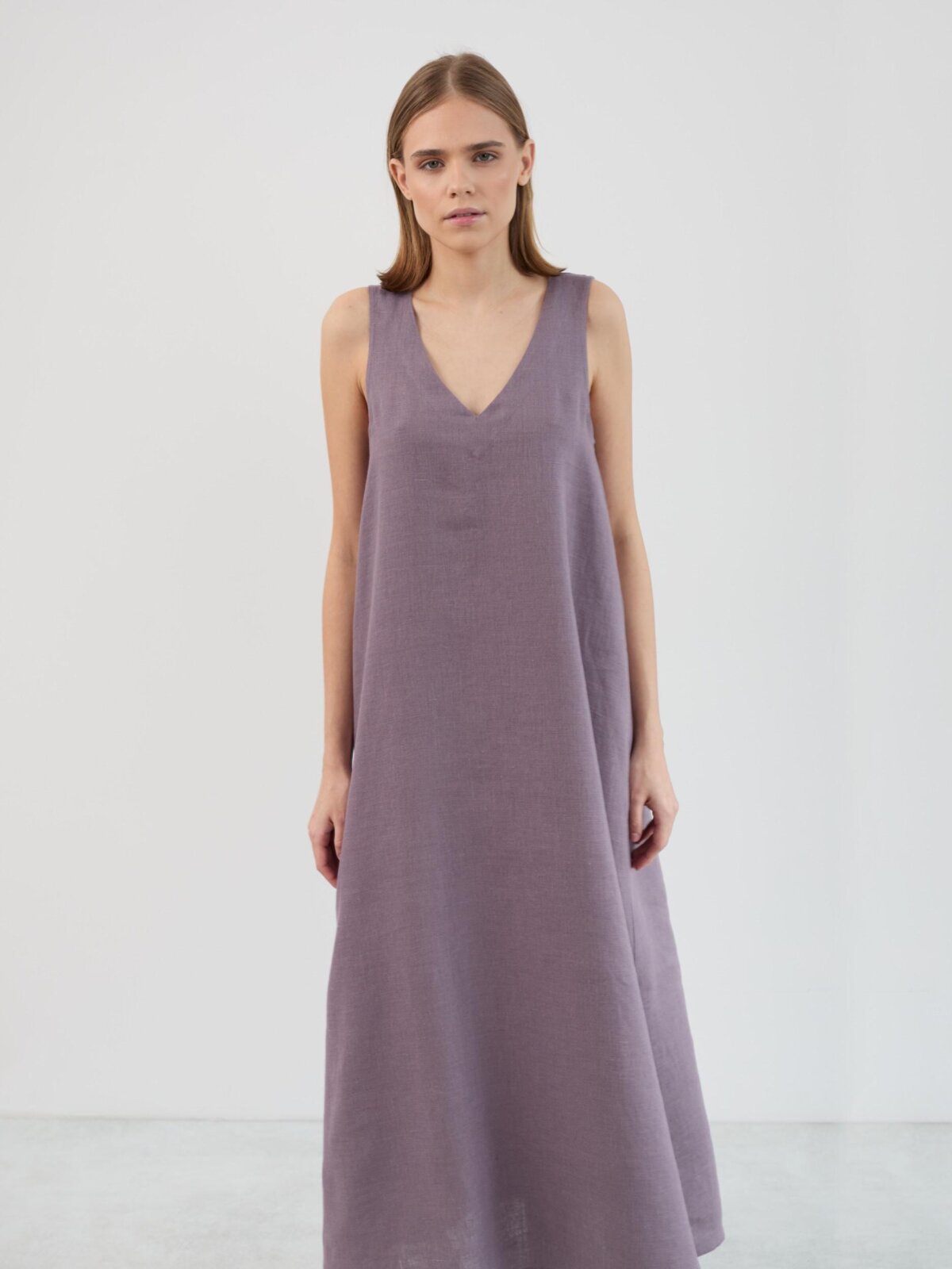 Upper body detail of the Lanav V neck linen dress in lavender violet, showing the deep neckline and sleeveless construction