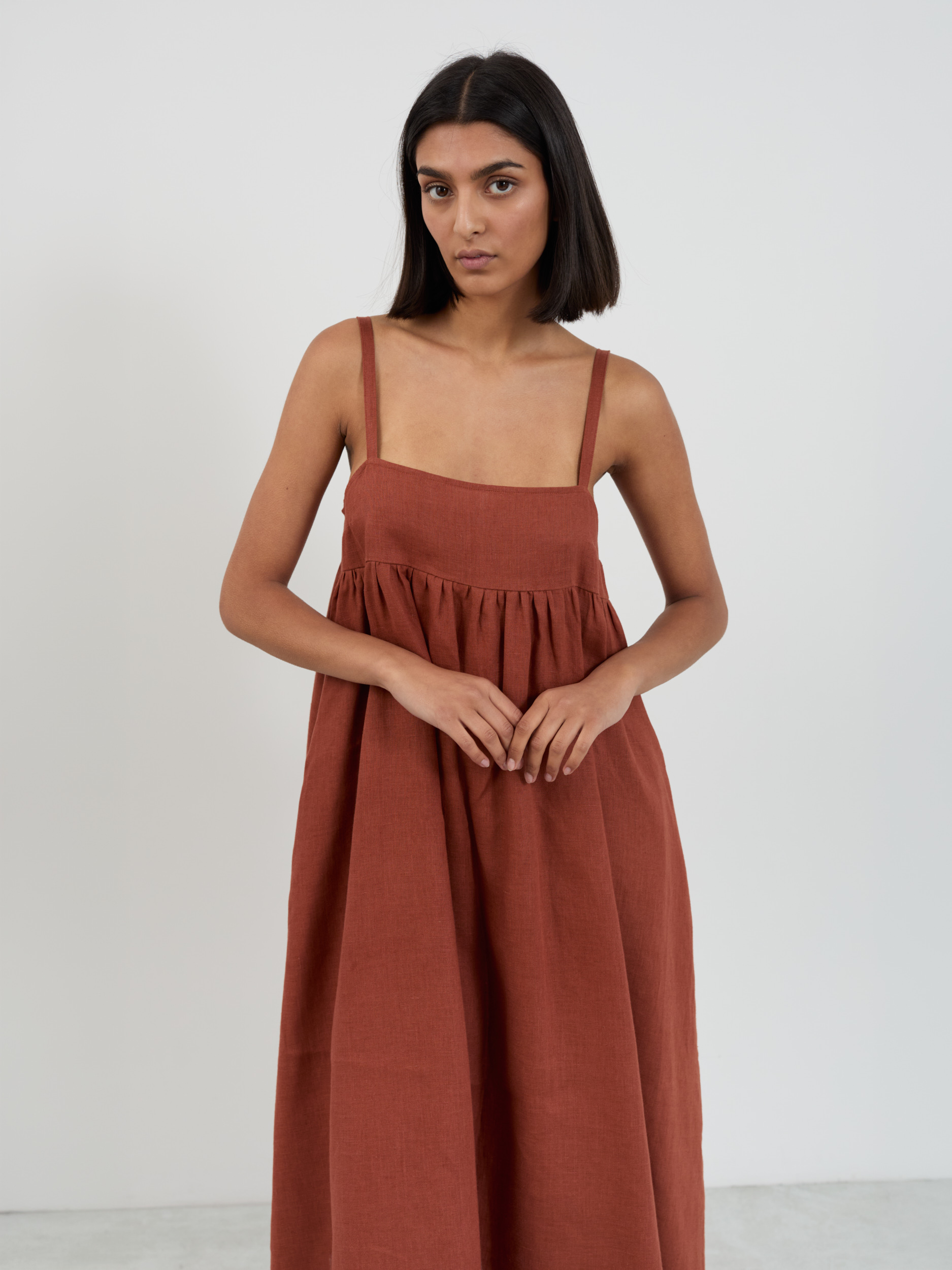 Wide strap linen sundress close-up showing square neckline and linen texture