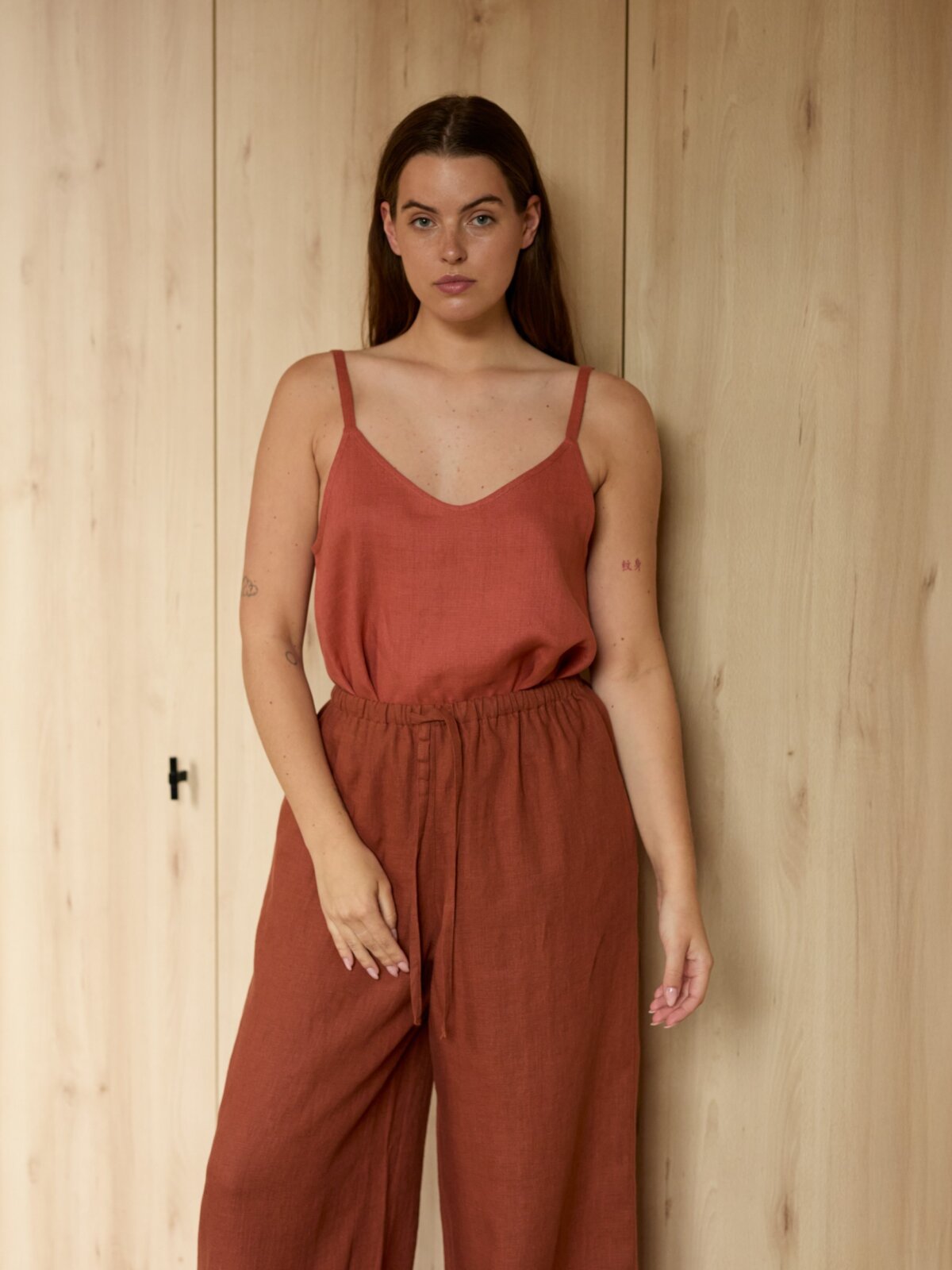 Image 1 of LUCAS wide-leg linen pants in Rust, featuring a drawstring waist and relaxed fit, from Love and Confuse.