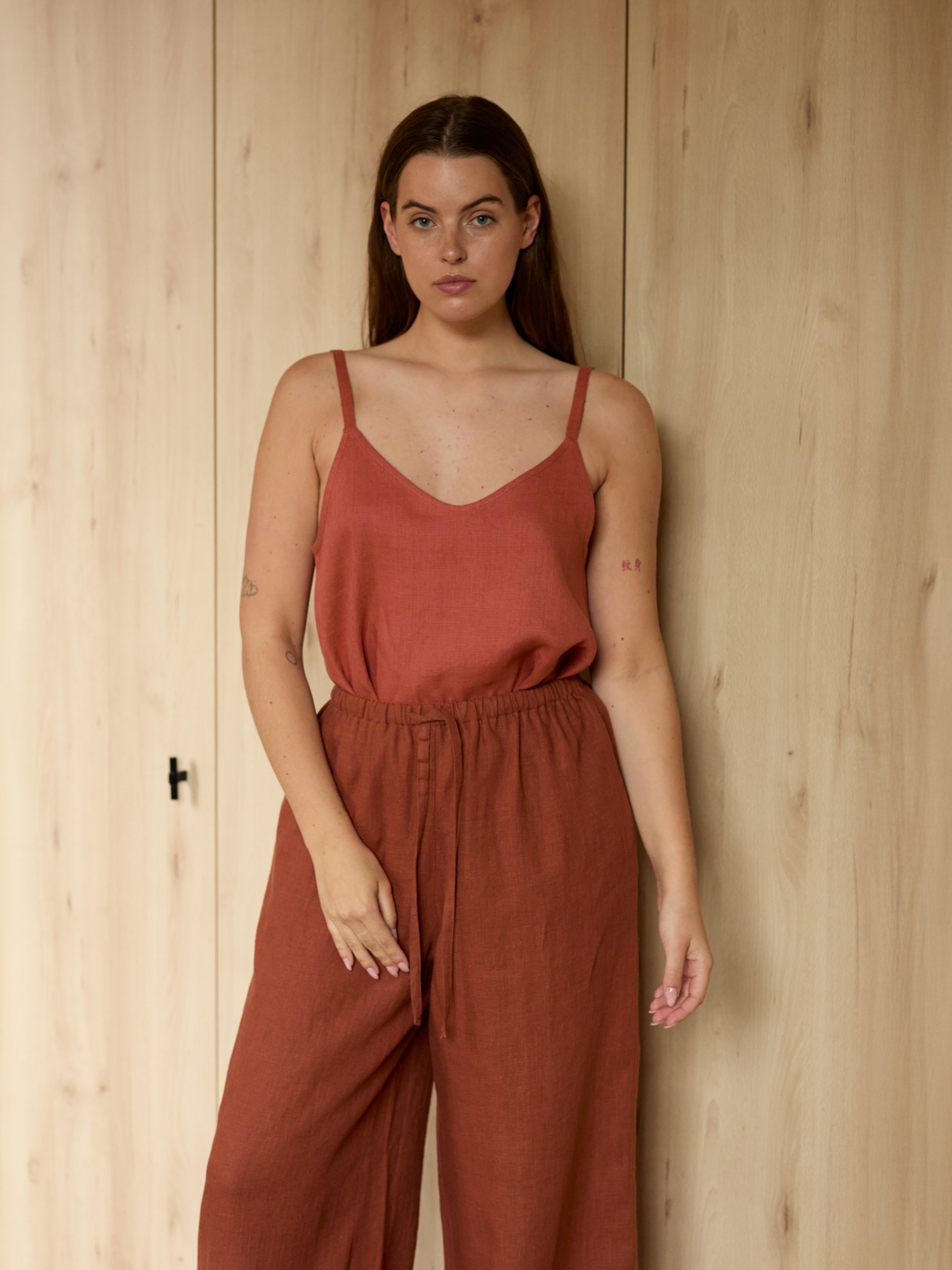 Image 1 of LUCAS wide-leg linen pants in Rust, featuring a drawstring waist and relaxed fit, from Love and Confuse.